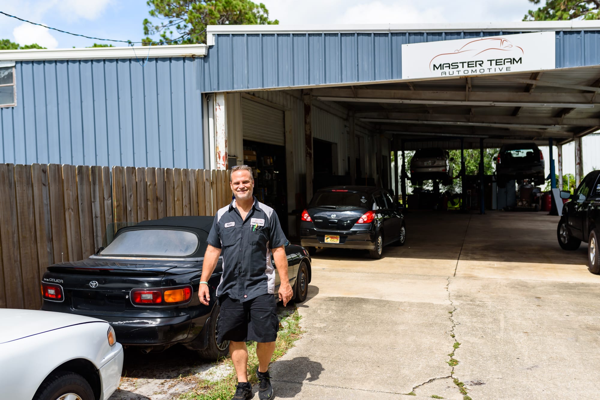 A Master Team Automotive technician at the open bay of the West Melbourne shop