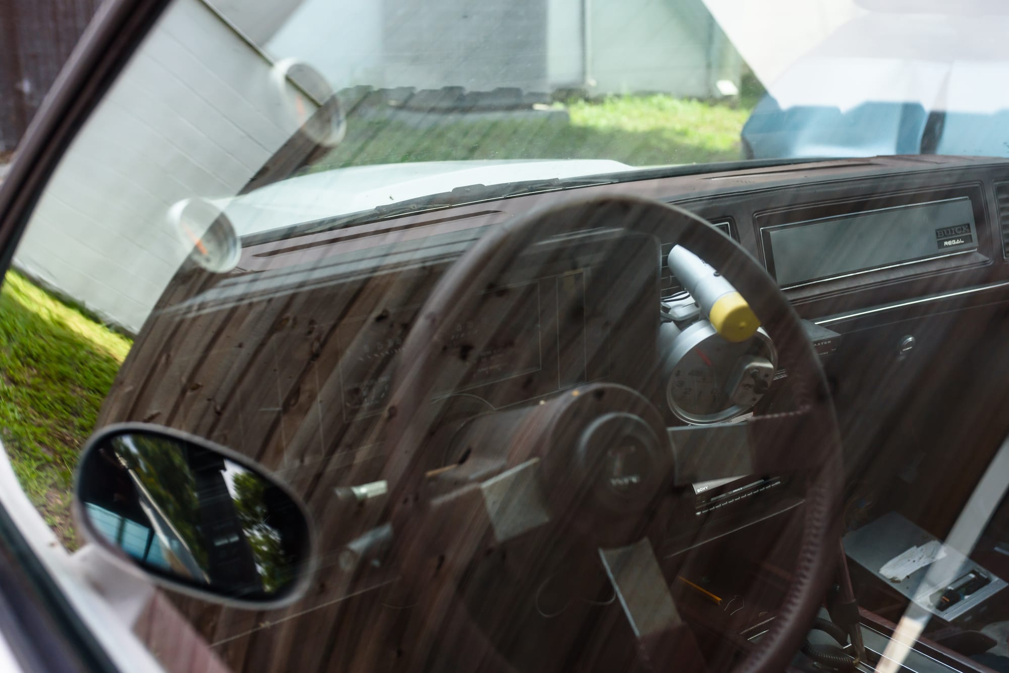 The dashboard and steering wheel of a classic car in for service