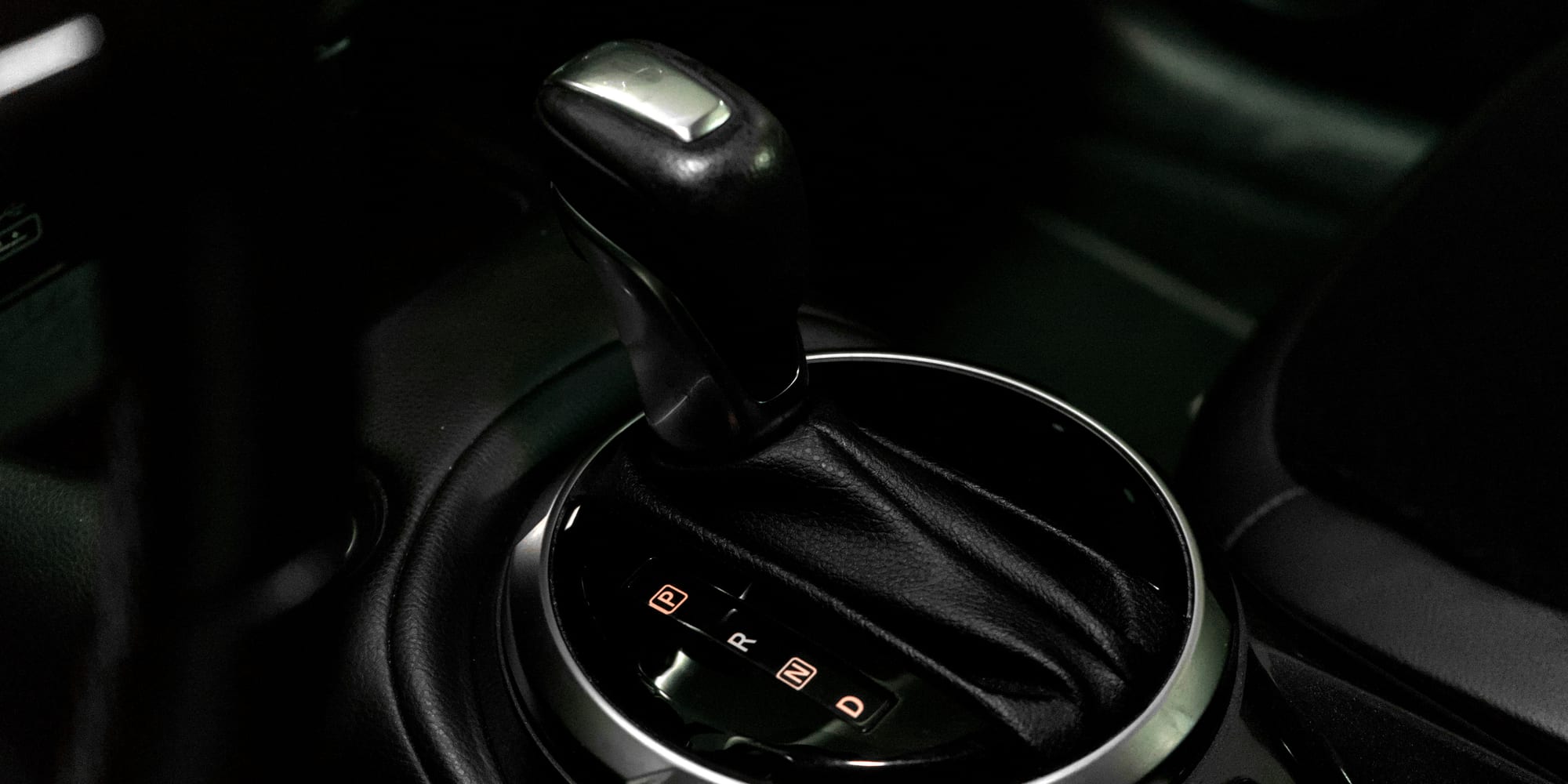 An illuminated automatic gear selector showing the P, R, N, and D positions